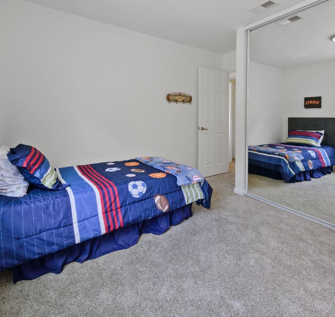 1276 Rosita Road Pacifica, CA 94044 - Photo 8 of 13 a bedroom with a bed and a couch