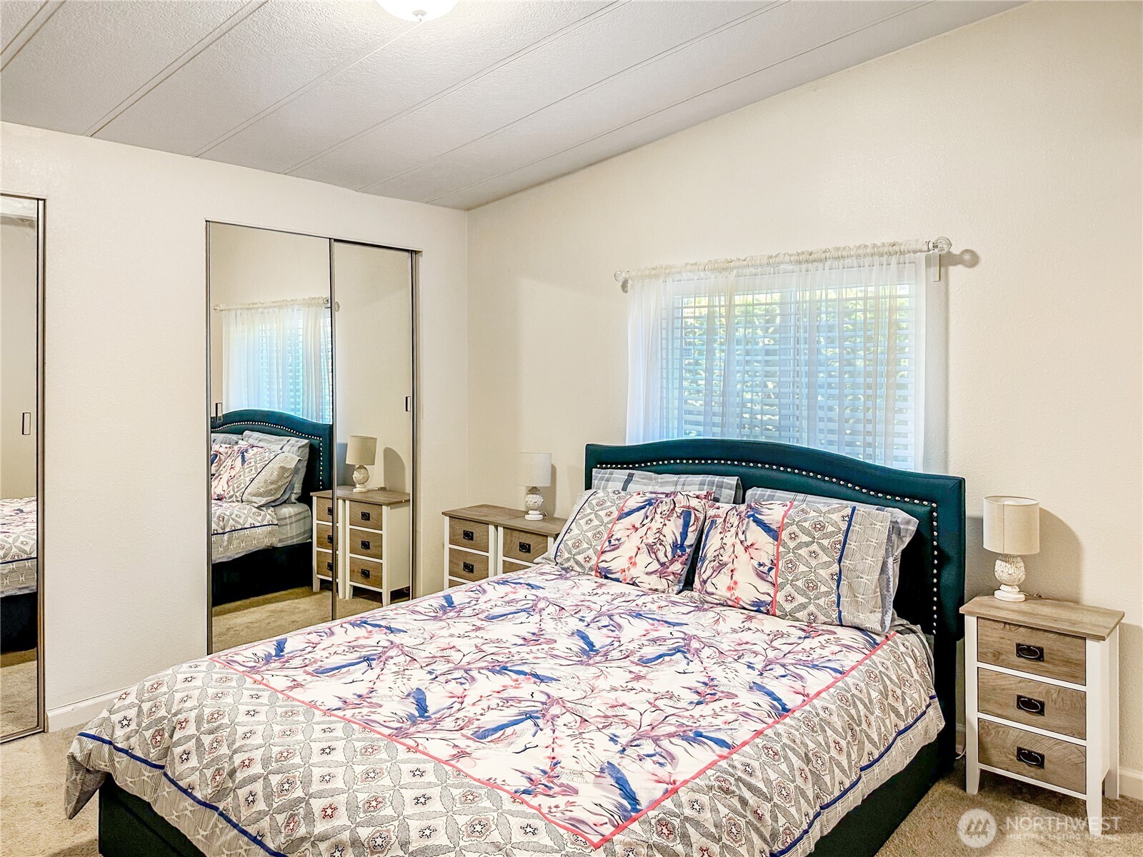 2500 South 370th Street, Unit 54 Federal Way, WA 98003 - Photo 12 of 40 a bedroom with a bed and a dresser
