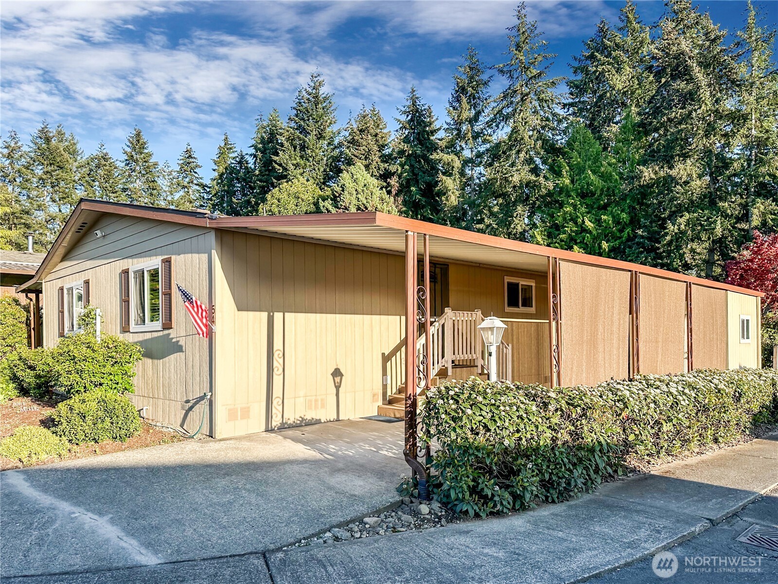 2500 South 370th Street, Unit 54 Federal Way, WA 98003 - Photo 16 of 40 a front view of a house with garden