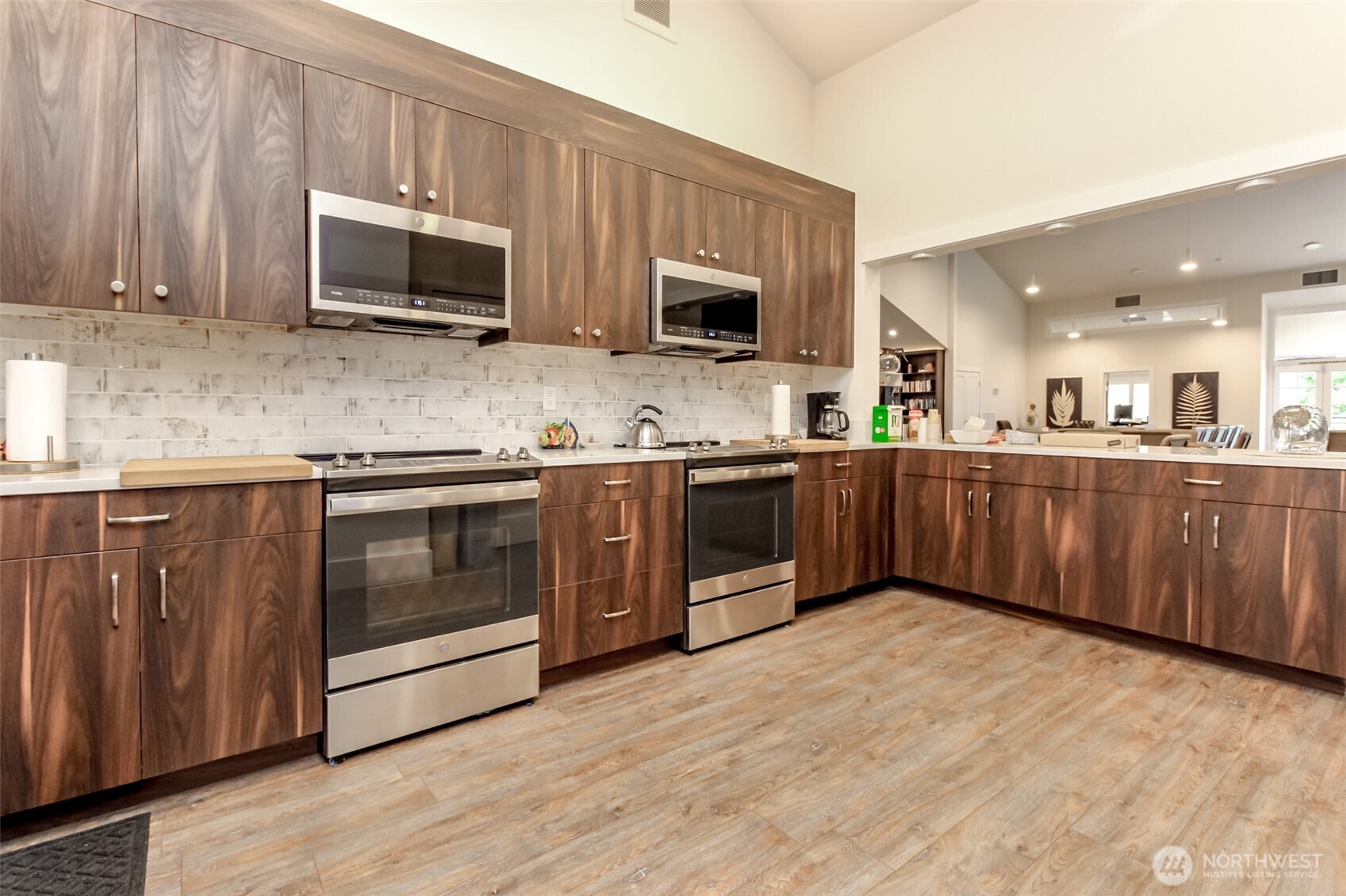 2500 South 370th Street, Unit 54 Federal Way, WA 98003 - Photo 30 of 40 a kitchen with stainless steel appliances granite countertop a stove microwave and sink