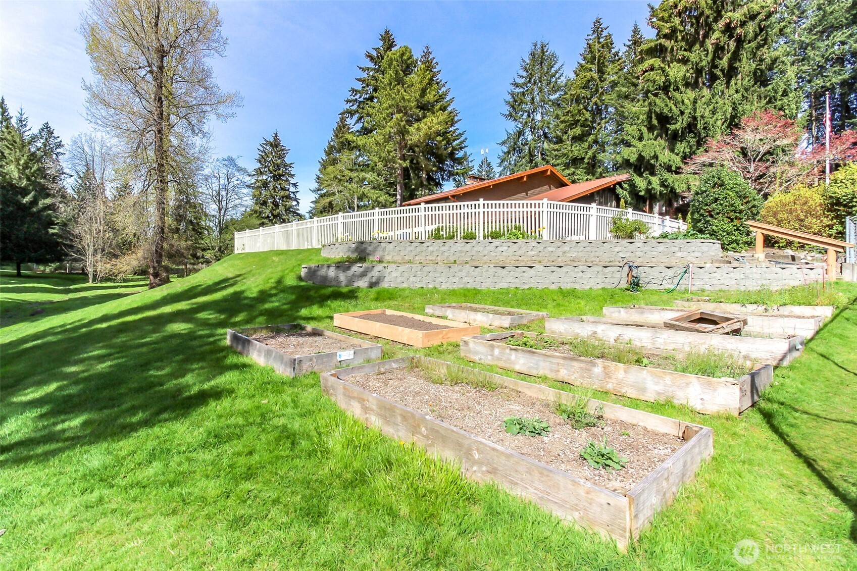 2500 South 370th Street, Unit 54 Federal Way, WA 98003 - Photo 40 of 40 a view of a house with a big yard and large trees
