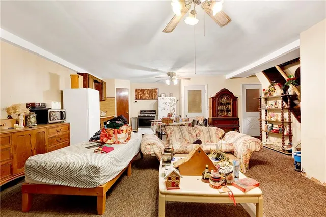 a living room with furniture and a chandelier