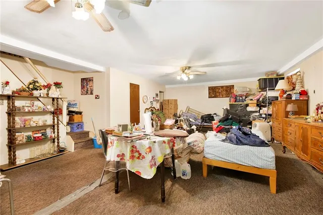 a living room with lots of furniture and a flat screen tv
