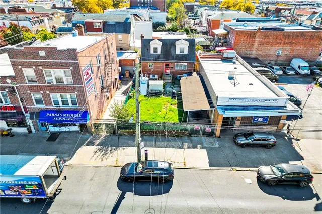 a building outdoor space with patio furniture and potted plants