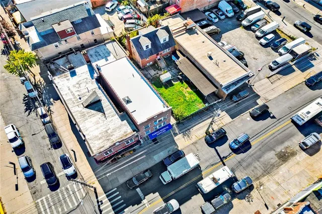 an aerial view of a house with a ocean view
