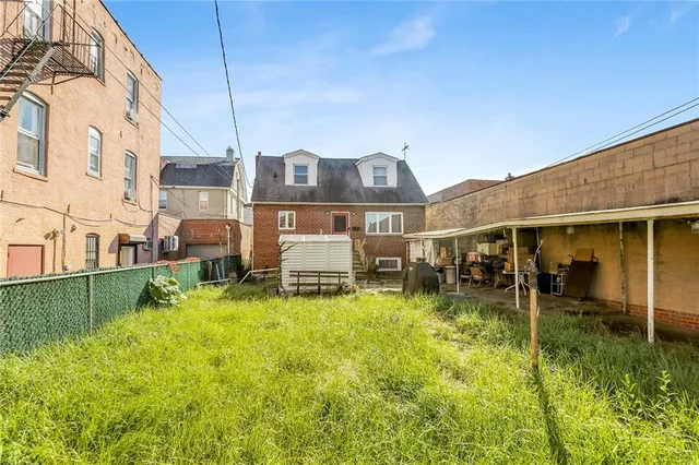 a view of a house with backyard porch and sitting area