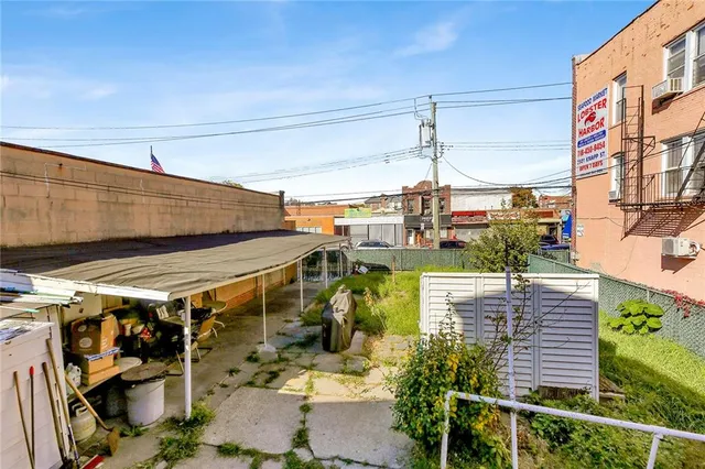 a view of a building with sitting area