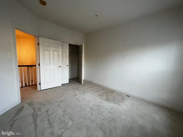 a view of an empty room and a window