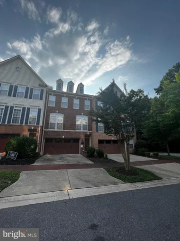 a view of a livingroom with a chandelier fan