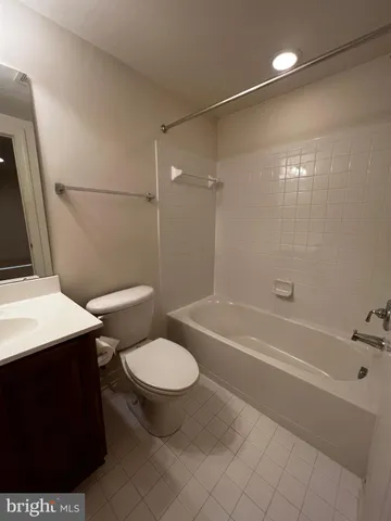 a bathroom with a toilet a sink and bathtub