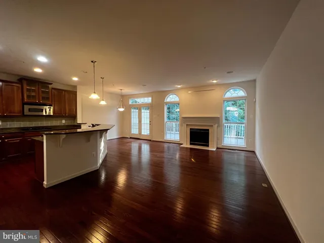 a kitchen with granite countertop counter space a sink appliances and cabinets