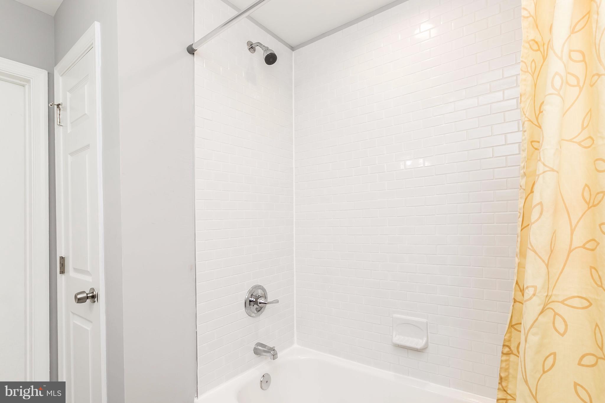 3827 Monterey Road Baltimore, MD 21218 - Photo 17 of 30 Subway Tiled Shower