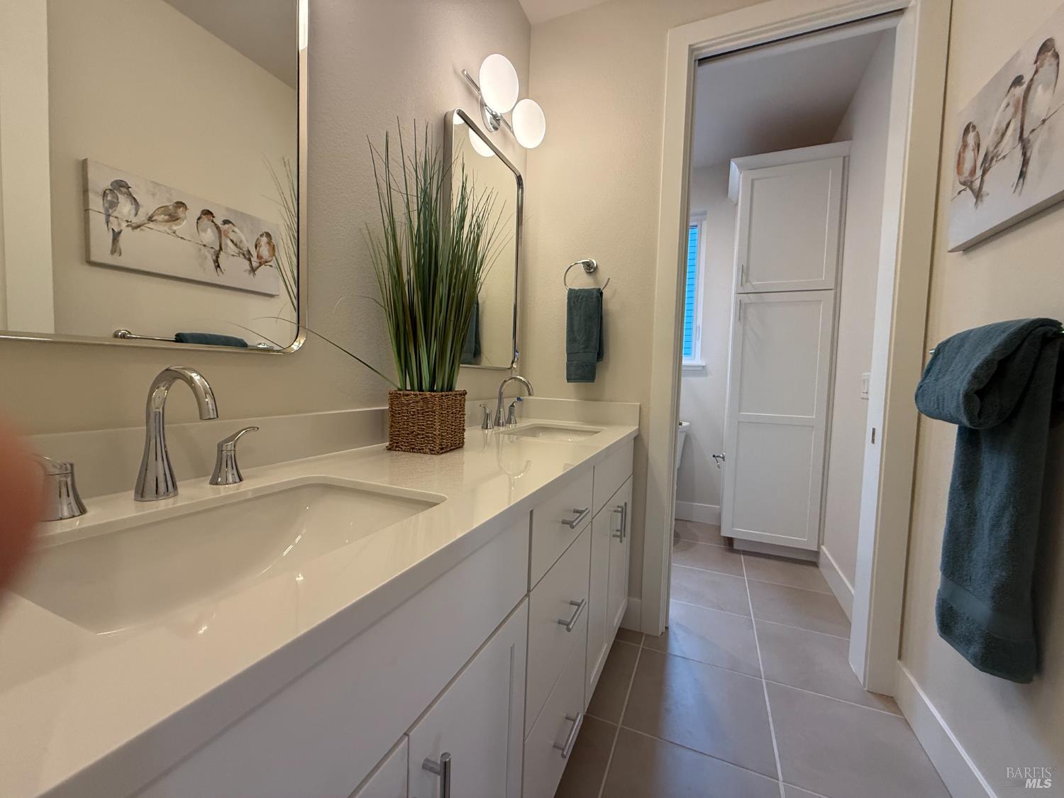 1901 Carlile Place Santa Rosa, CA 95403 - Photo 18 of 29 a bathroom with a double vanity sink and a mirror