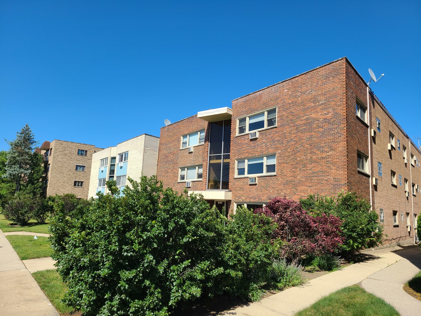 8161 Niles Center Road, Unit 2D Skokie, IL 60077 - Photo 2 of 23 a front view of a multi story building