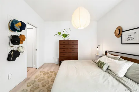 a bedroom with a bed and cabinets