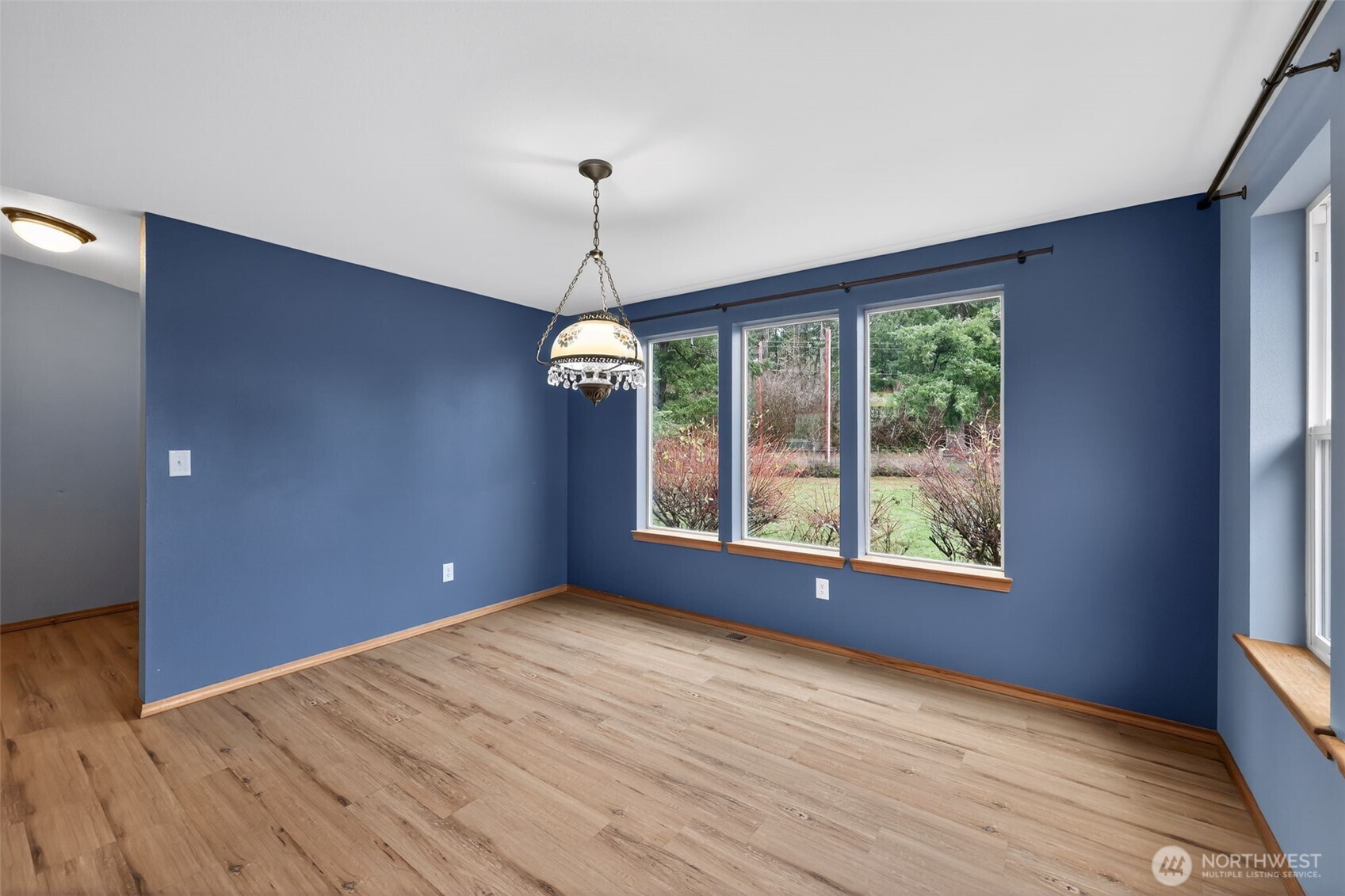 222 Oyler Road Ethel, WA 98542 - Photo 12 of 34 a view of an empty room with a window and wooden floor