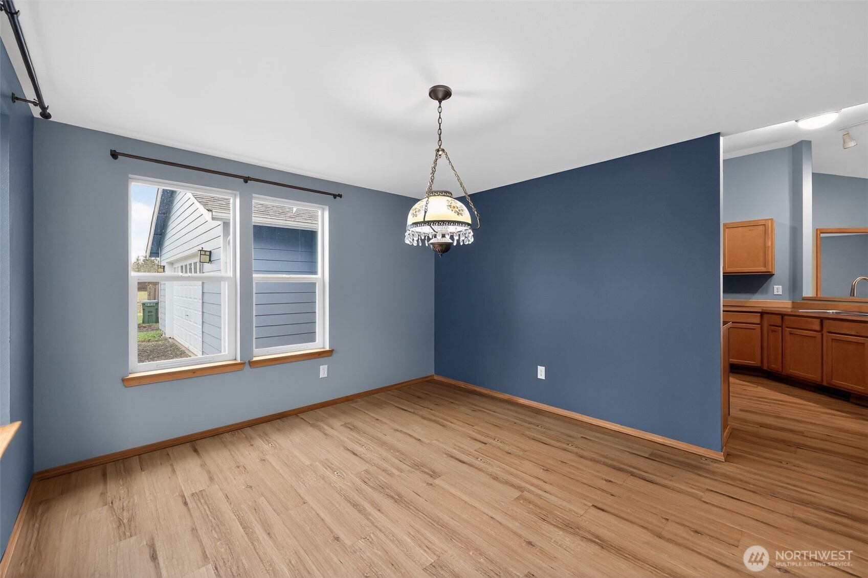 222 Oyler Road Ethel, WA 98542 - Photo 15 of 34 a view of a room with wooden floor exposed radiator and windows