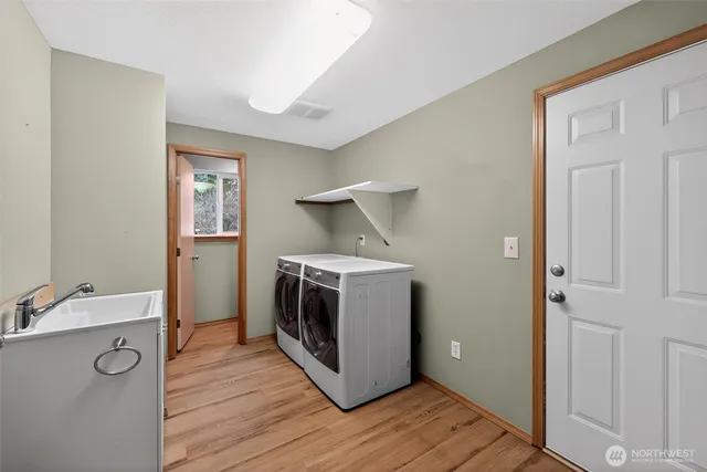 a view of a storage & utility room with wooden floor