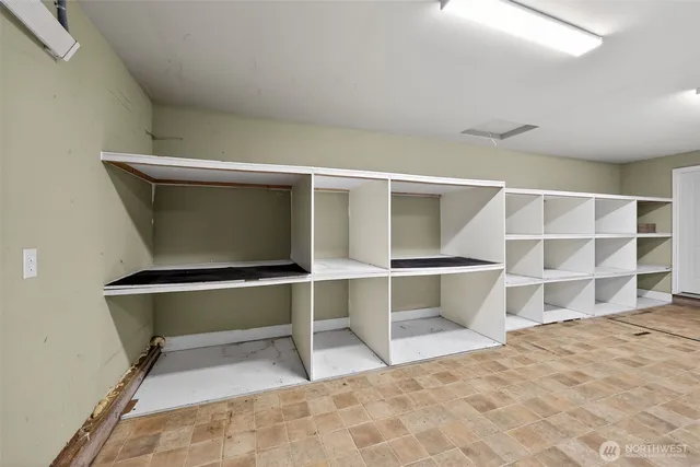 a view of an empty room with a staircase