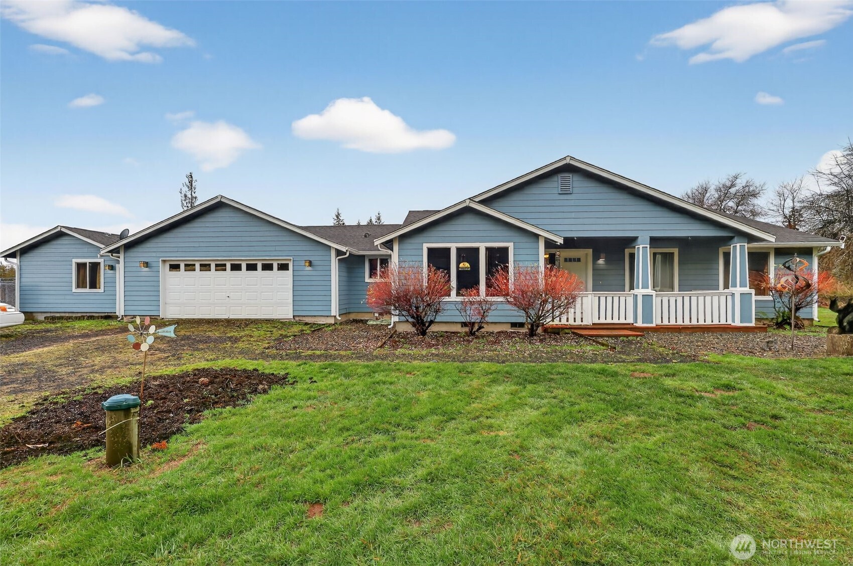 222 Oyler Road Ethel, WA 98542 - Photo 30 of 34 a view of a house with a yard and chairs