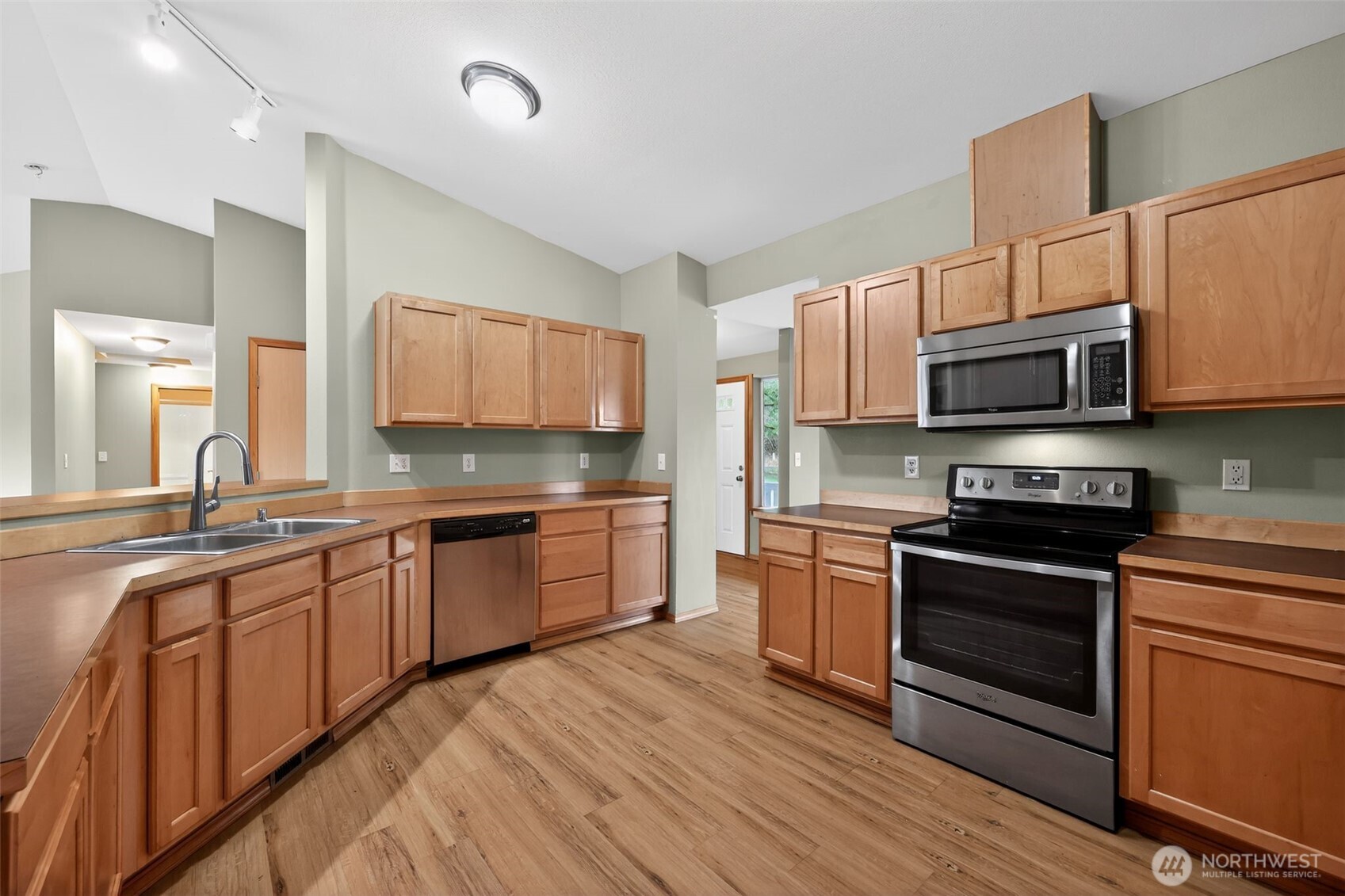 222 Oyler Road Ethel, WA 98542 - Photo 3 of 34 a kitchen with stainless steel appliances granite countertop wooden cabinets a stove top oven a sink and dishwasher