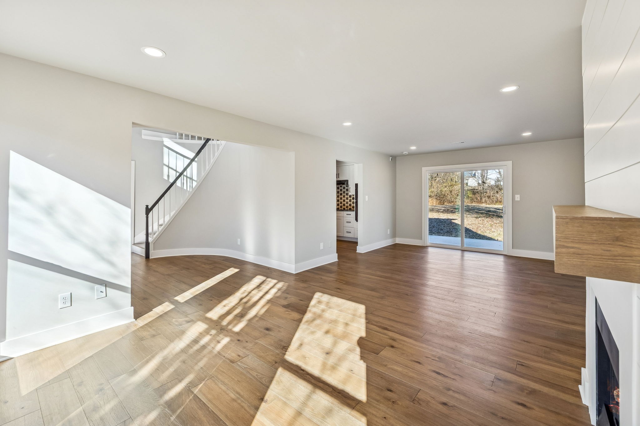 628 Vaughan's Gap Road Spring Hill, TN 37174 - Photo 11 of 45 a view of an empty room with window and wooden floor