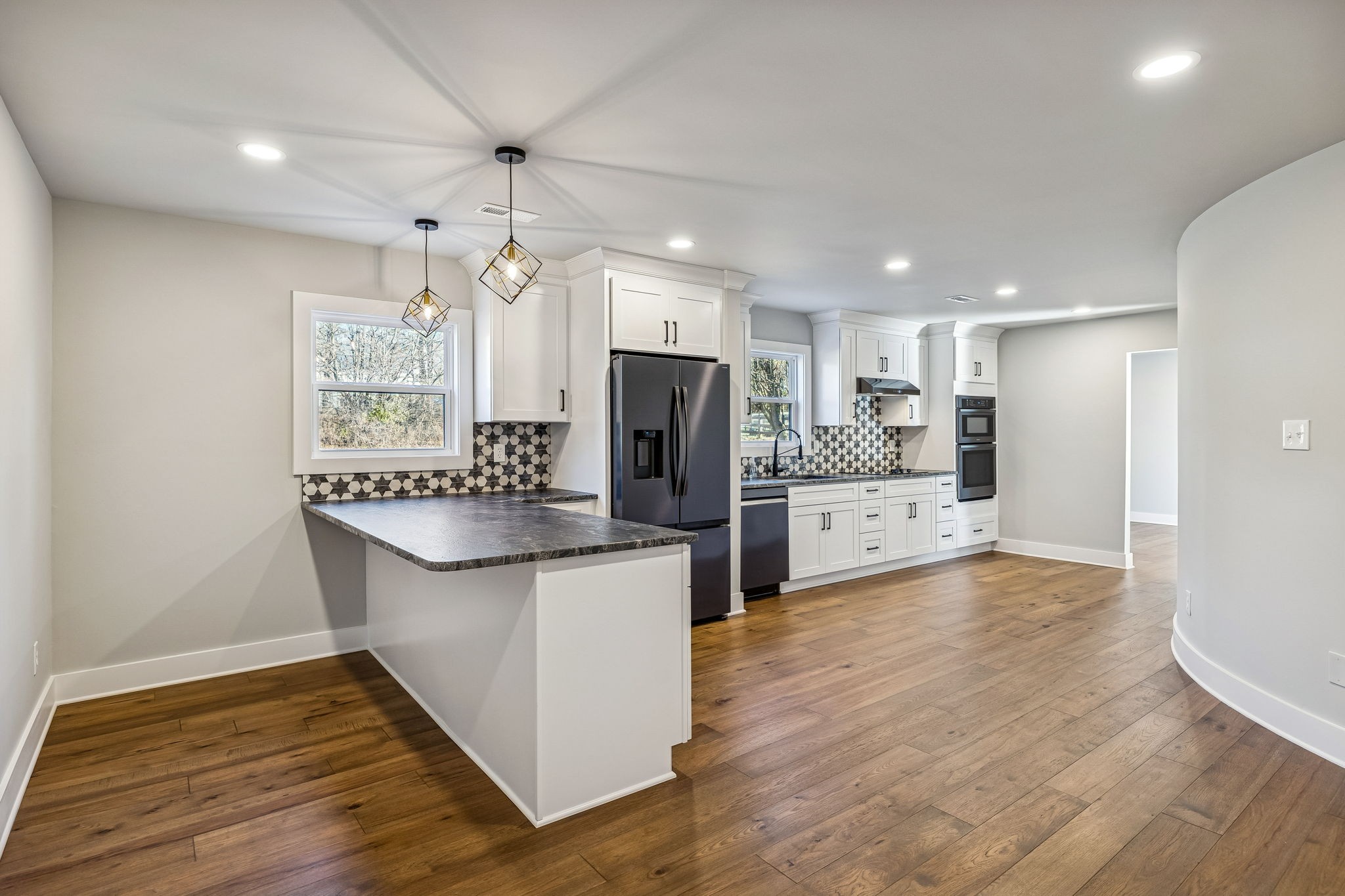 628 Vaughan's Gap Road Spring Hill, TN 37174 - Photo 15 of 45 a kitchen with stainless steel appliances a refrigerator sink and microwave