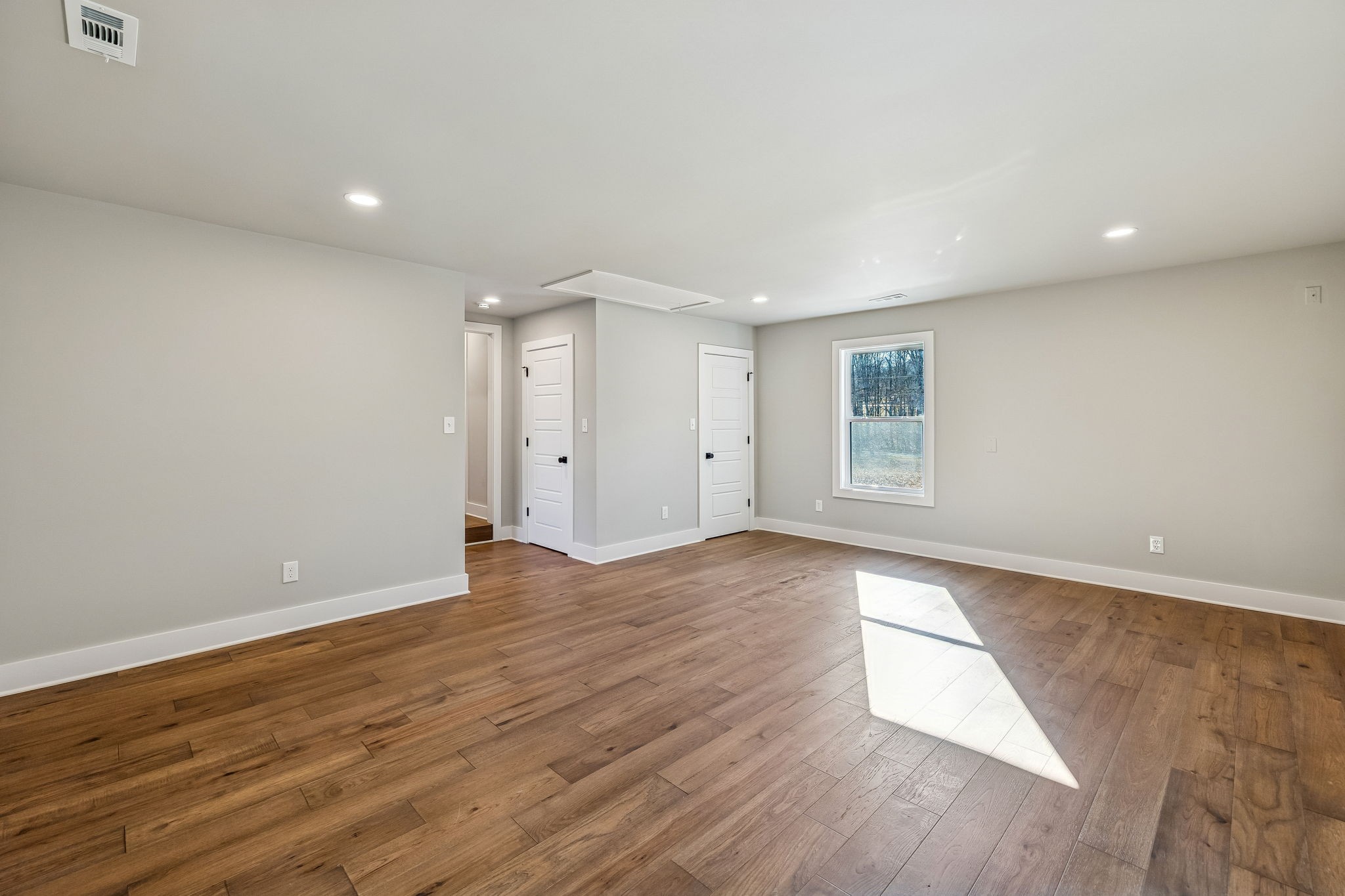 628 Vaughan's Gap Road Spring Hill, TN 37174 - Photo 20 of 45 a view of an empty room with wooden floor and window