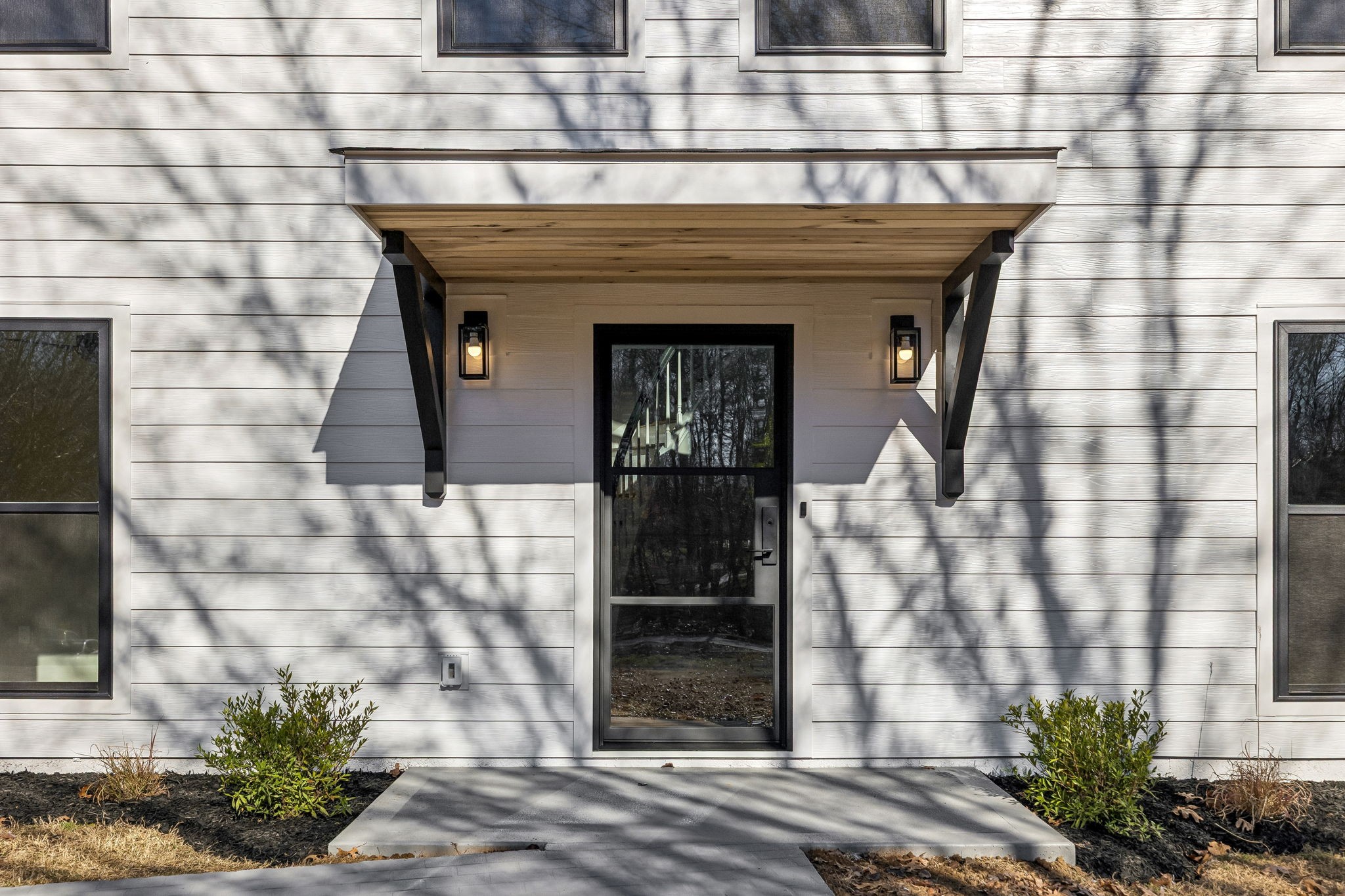 628 Vaughan's Gap Road Spring Hill, TN 37174 - Photo 2 of 45 a front view of a building with potted plants