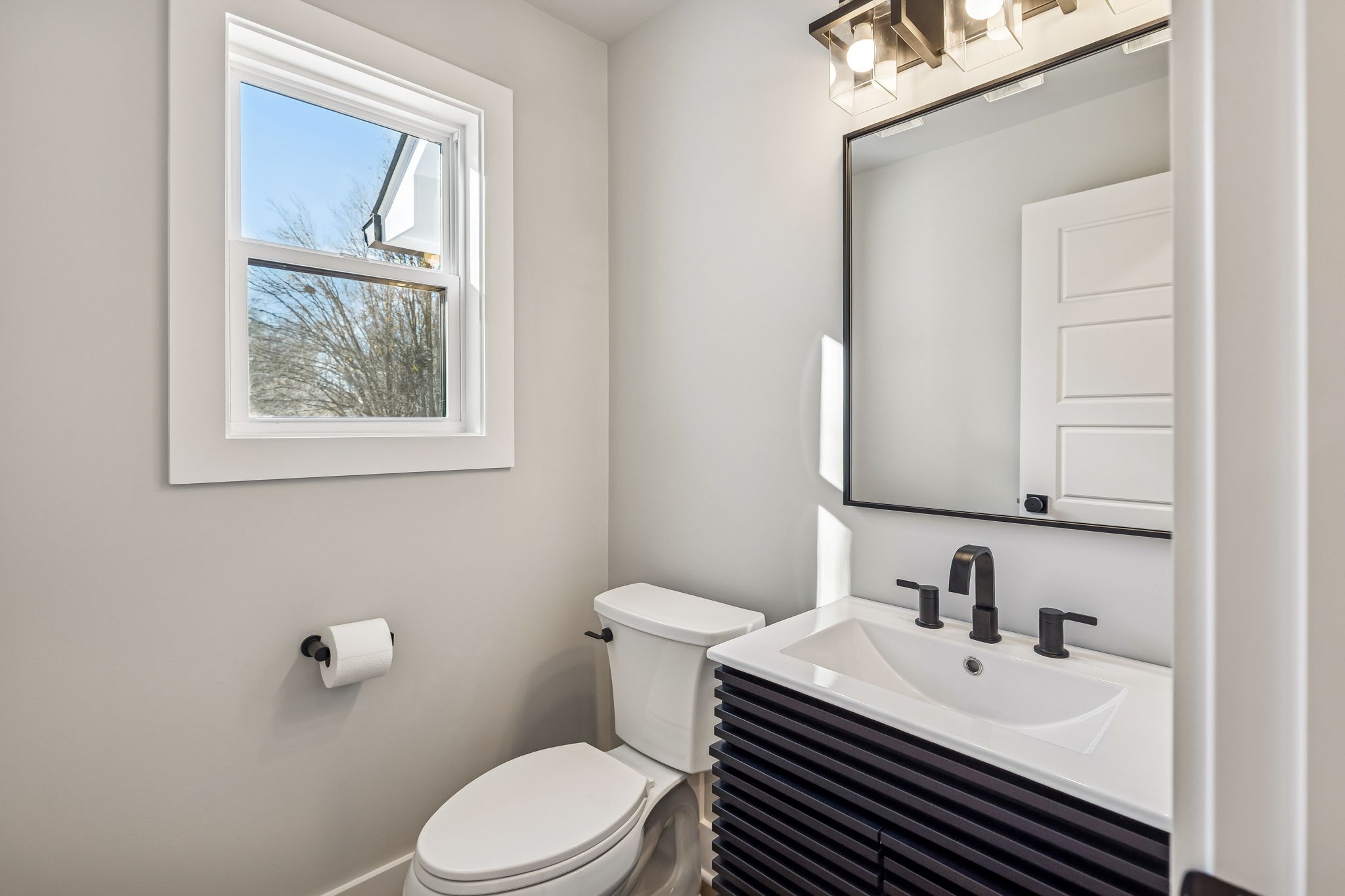 628 Vaughan's Gap Road Spring Hill, TN 37174 - Photo 21 of 45 a bathroom with a sink vanity mirror and toilet
