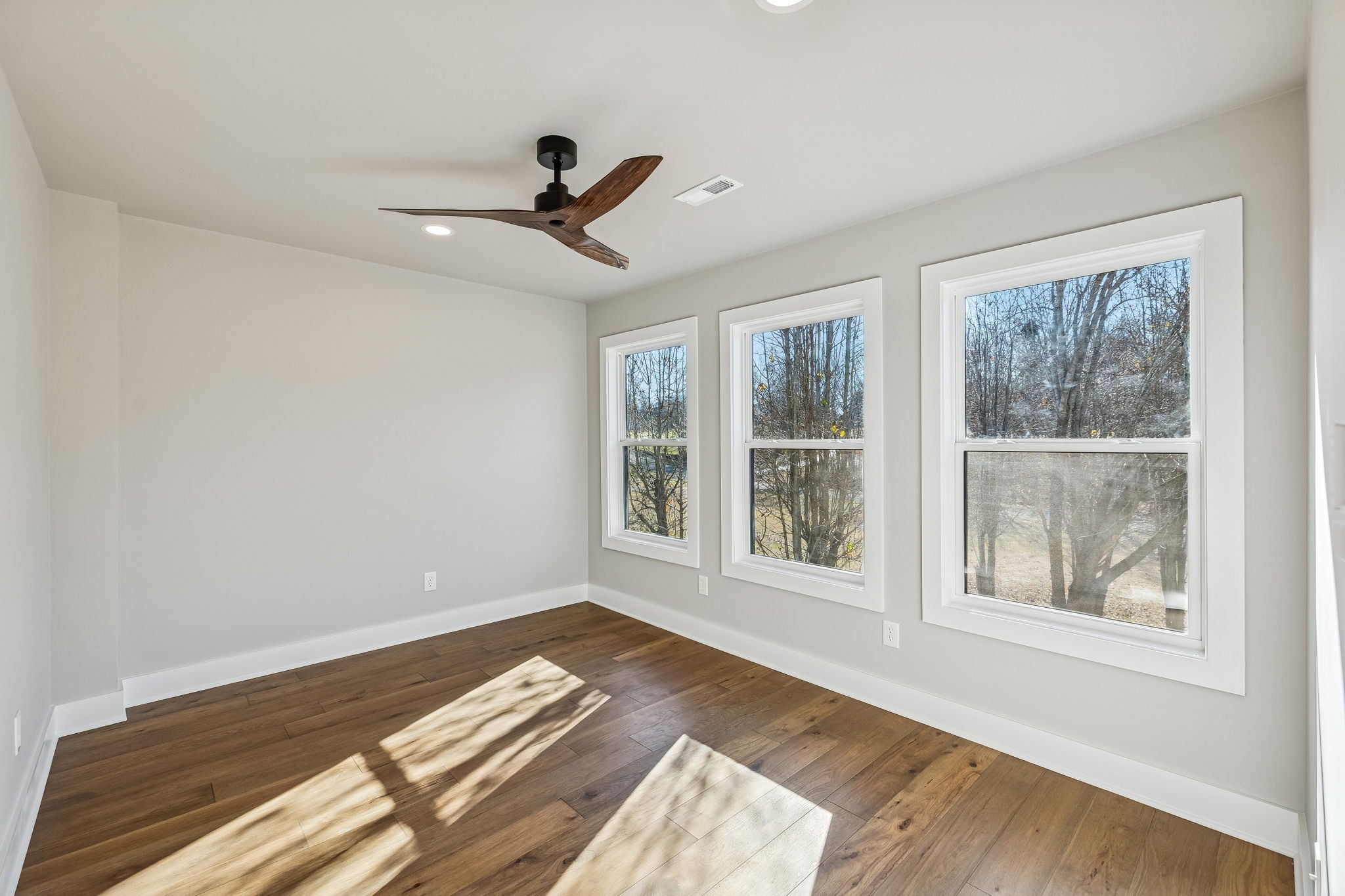 628 Vaughan's Gap Road Spring Hill, TN 37174 - Photo 28 of 45 a view of empty room with wooden floor and fan