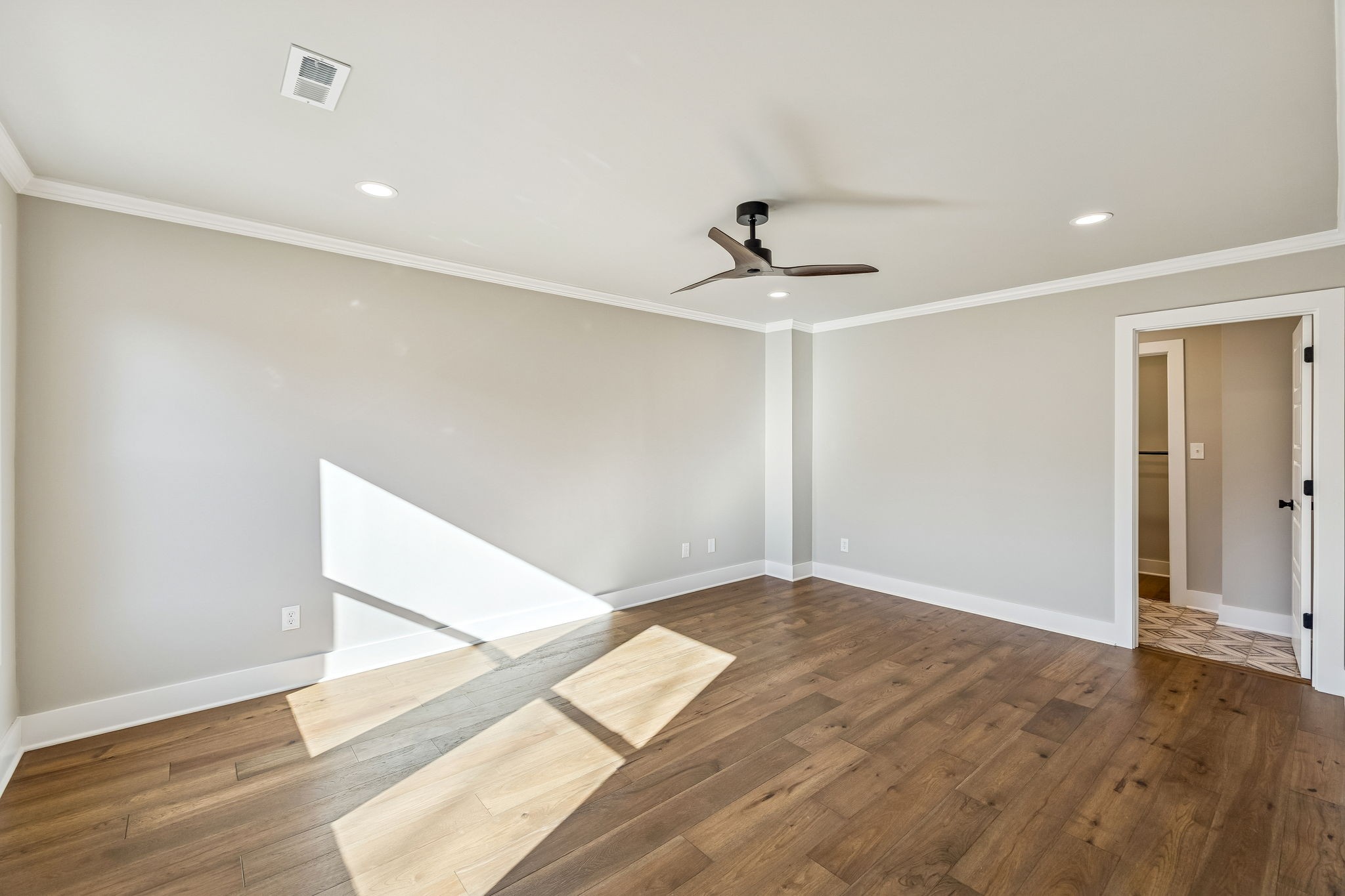 628 Vaughan's Gap Road Spring Hill, TN 37174 - Photo 32 of 45 a view of empty room with wooden floor and fan