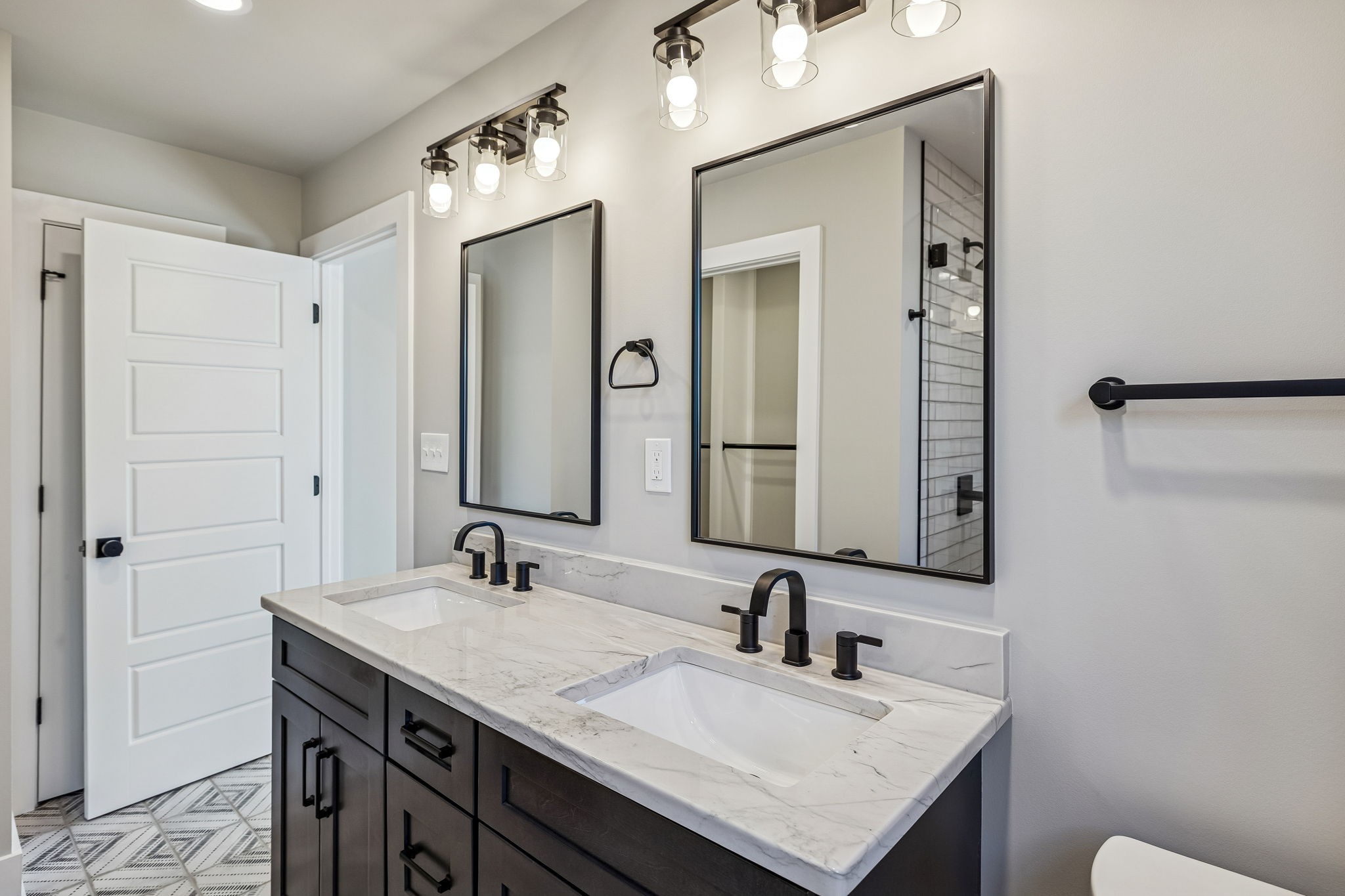 628 Vaughan's Gap Road Spring Hill, TN 37174 - Photo 35 of 45 a bathroom with a sink and a mirror
