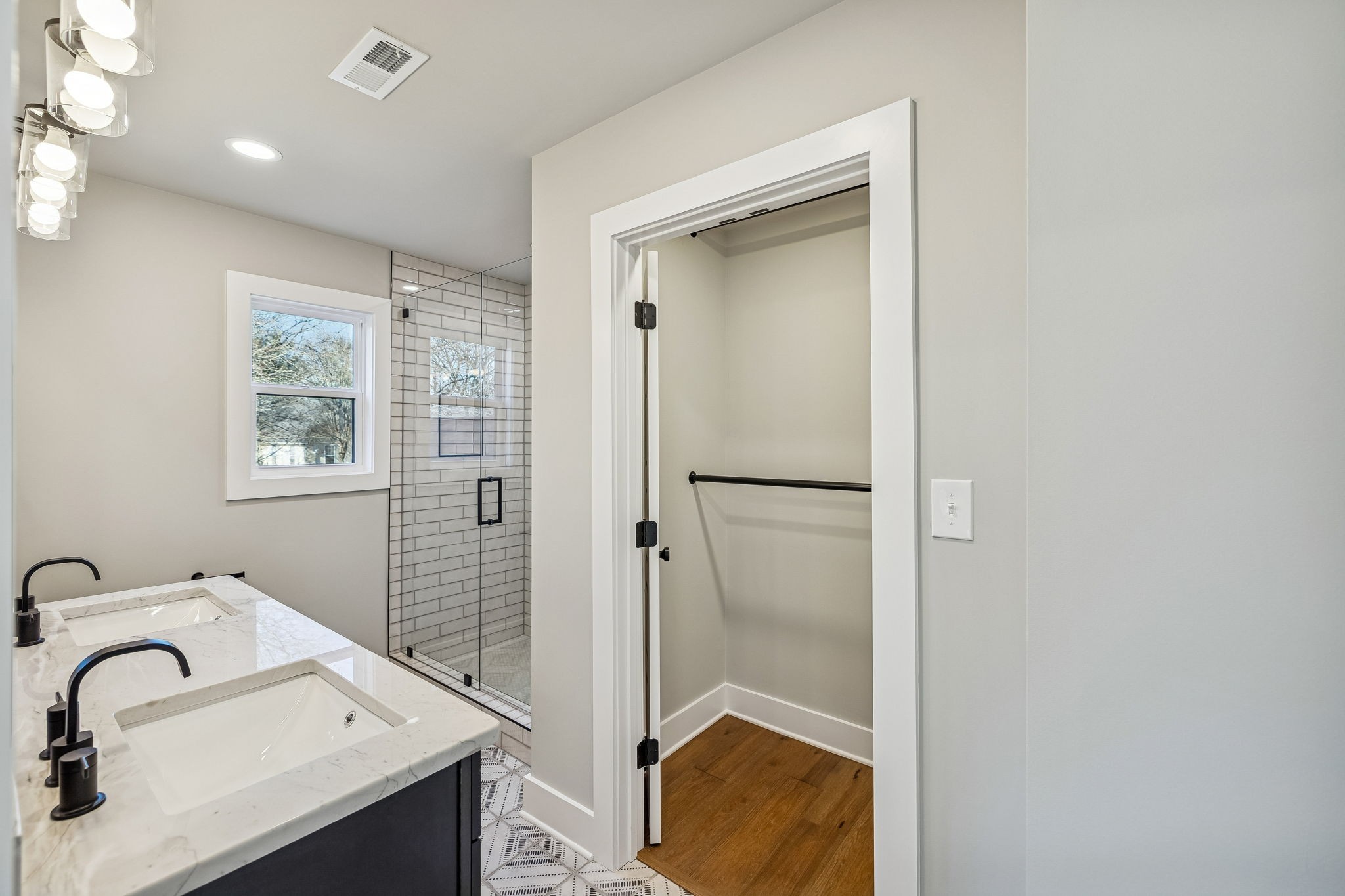 628 Vaughan's Gap Road Spring Hill, TN 37174 - Photo 37 of 45 a bathroom with a sink and a mirror