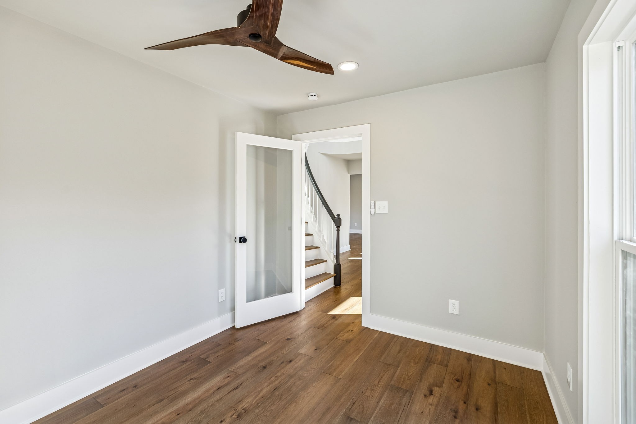 628 Vaughan's Gap Road Spring Hill, TN 37174 - Photo 4 of 45 a view of an empty room with wooden floor and stairs