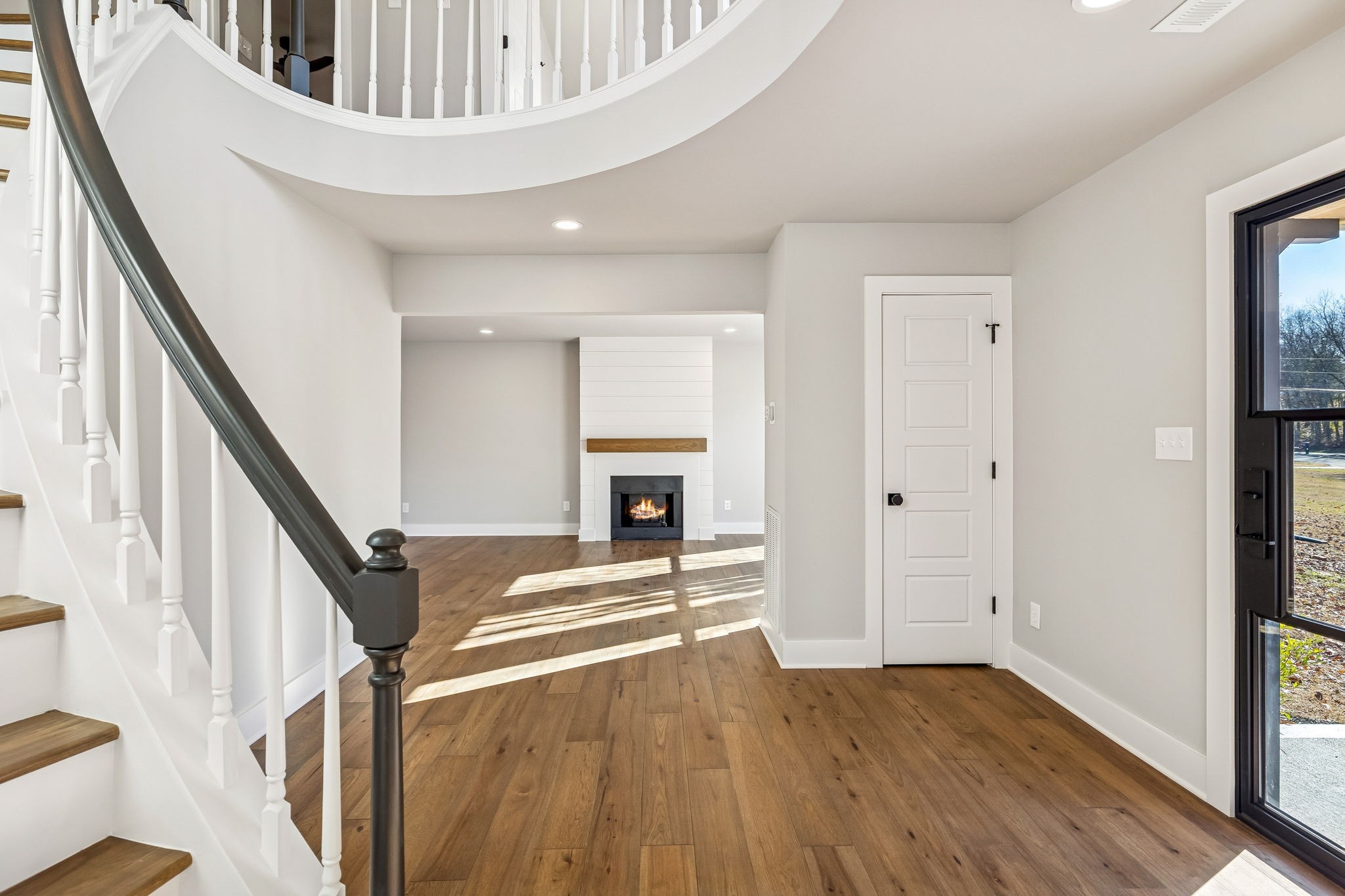 628 Vaughan's Gap Road Spring Hill, TN 37174 - Photo 6 of 45 a view of an entryway with wooden floor and staircase