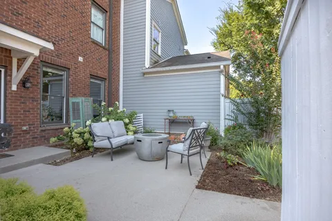 a view of a house with a yard and a garden
