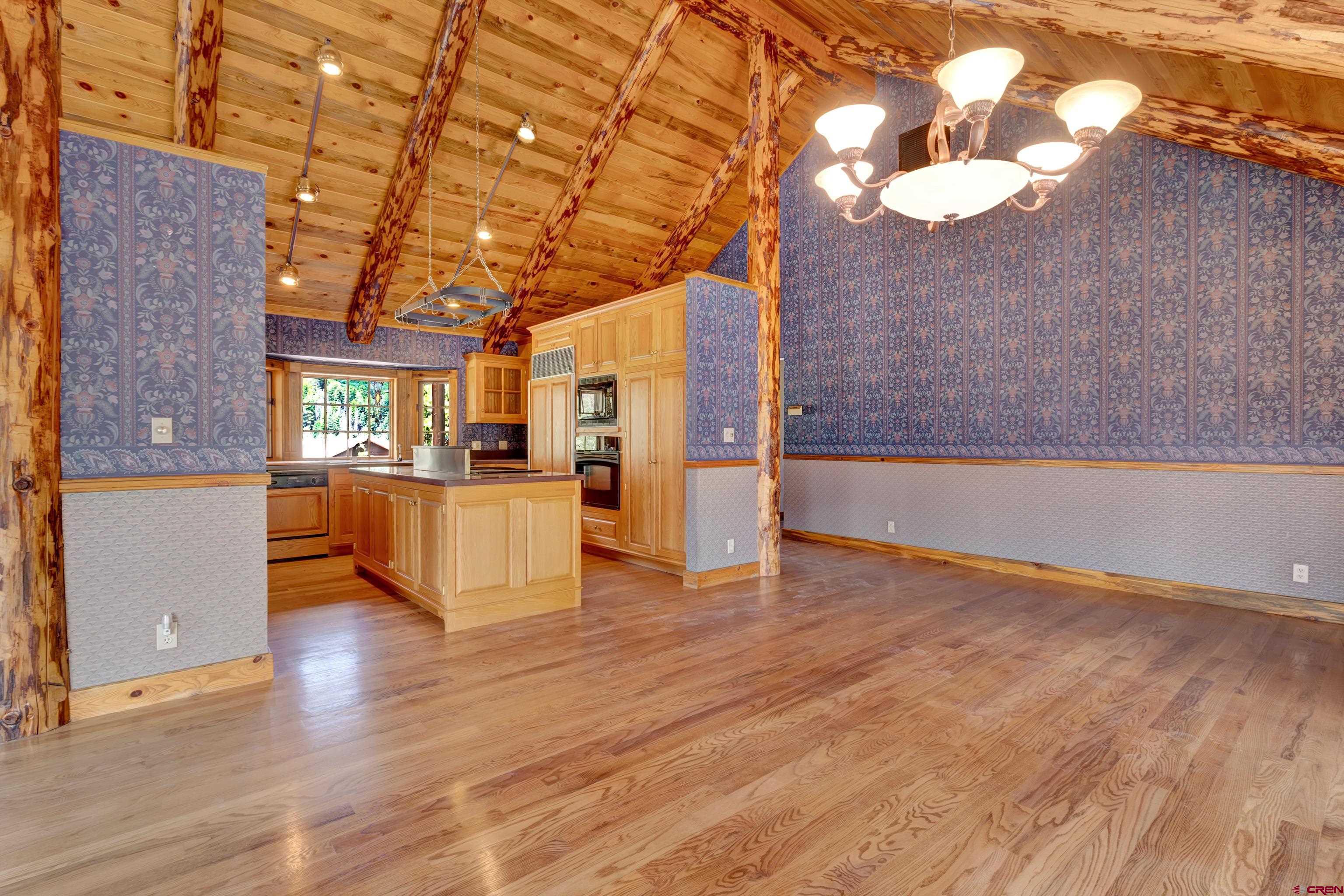 2692 County Road 17 Ridgway, CO 81432 - Photo 9 of 38 a view of empty room with wooden floor