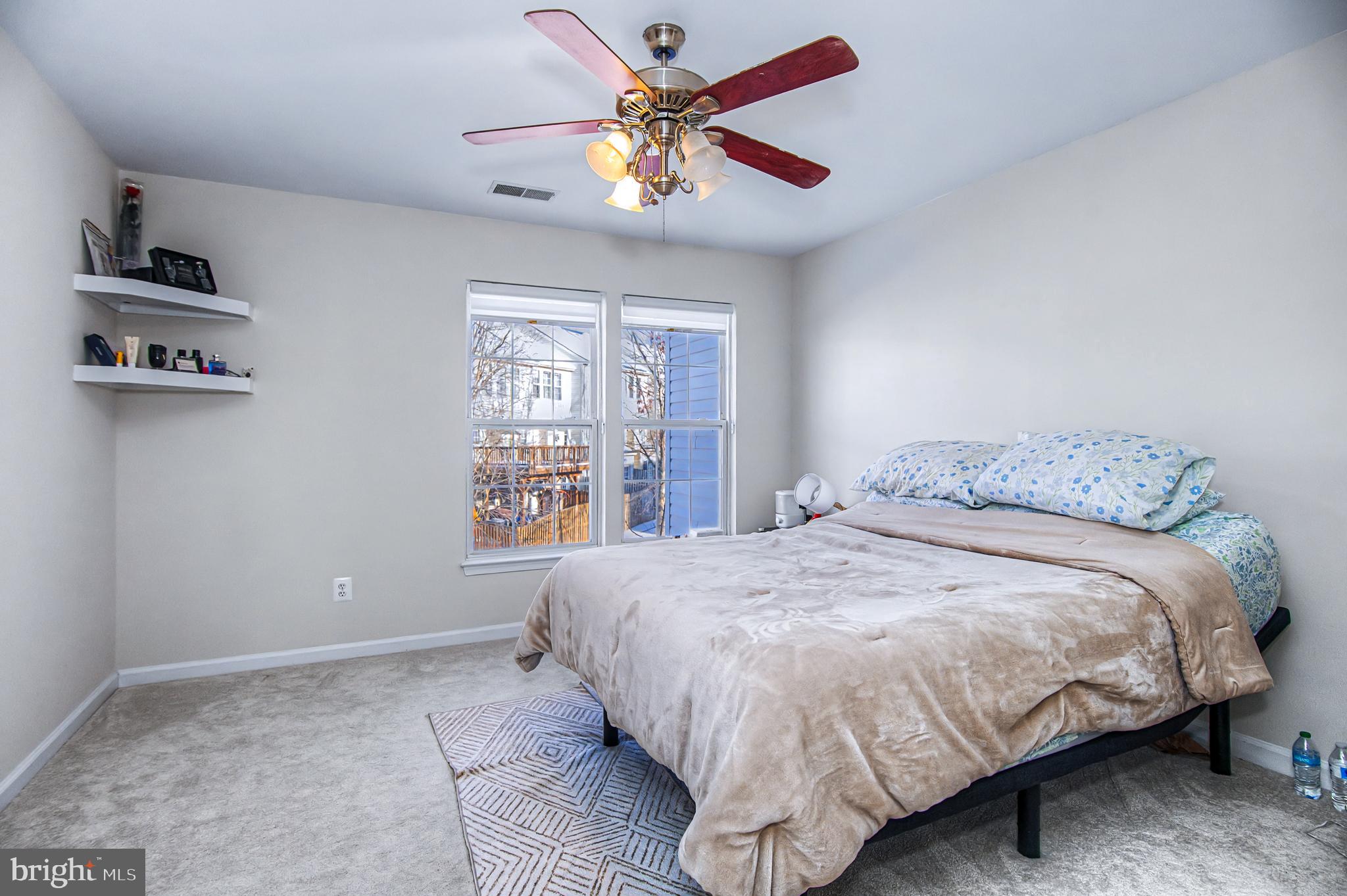 10159 Elgin Way Bristow, VA 20136 - Photo 16 of 41 a bedroom with a bed and a window