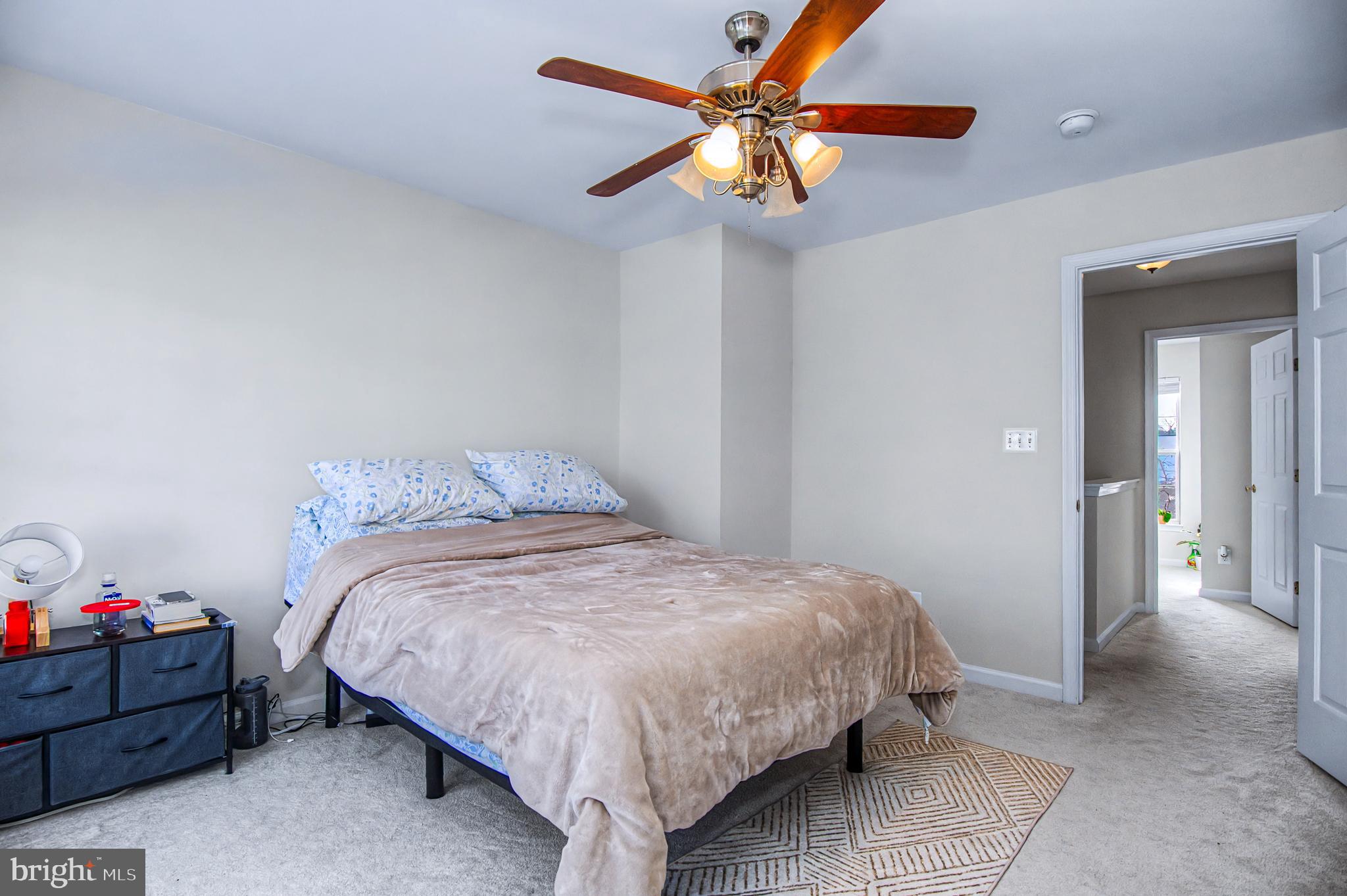 10159 Elgin Way Bristow, VA 20136 - Photo 18 of 41 a bedroom with a bed and a chandelier