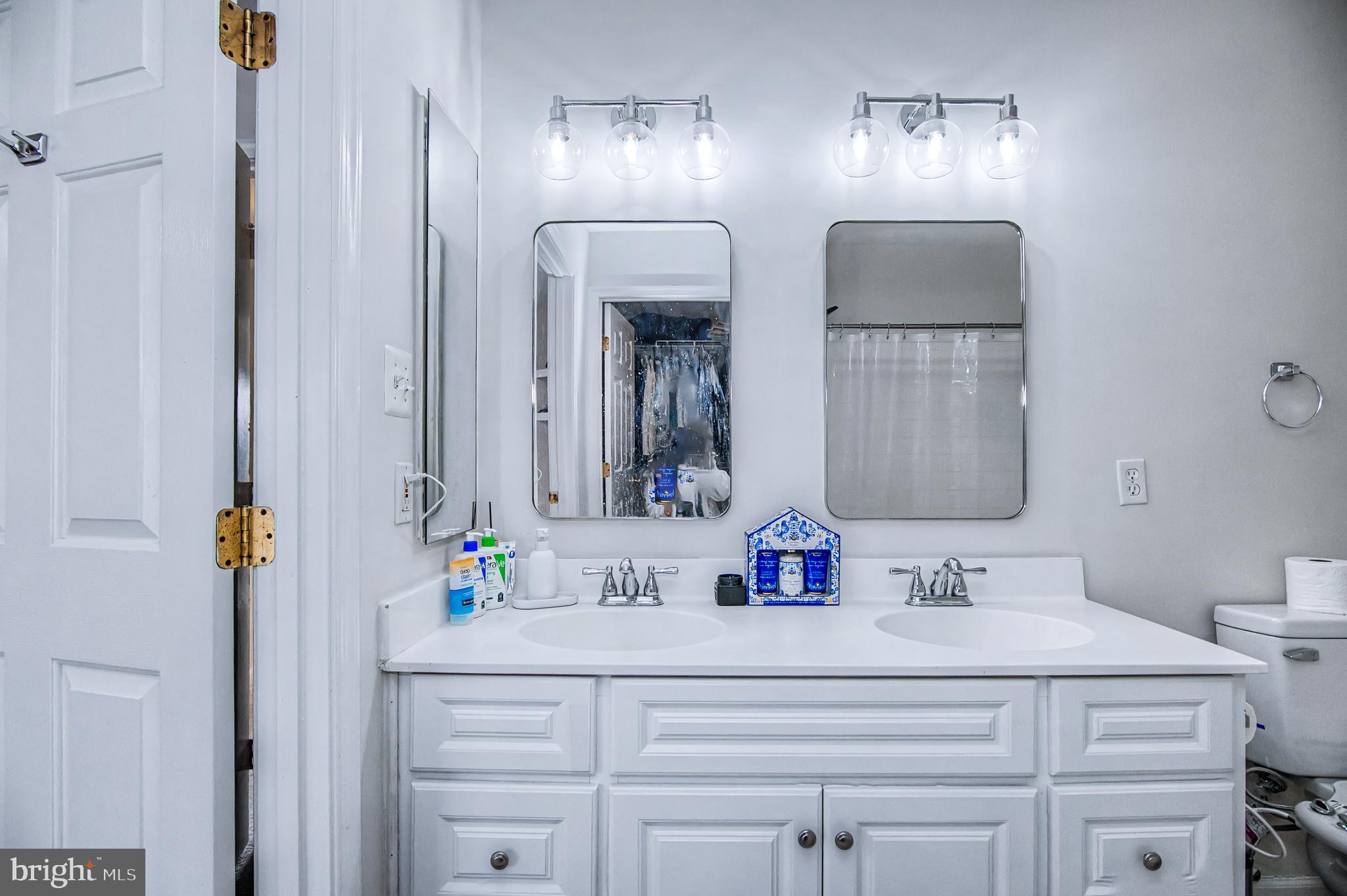 10159 Elgin Way Bristow, VA 20136 - Photo 19 of 41 a bathroom with double vanity sink and a mirror