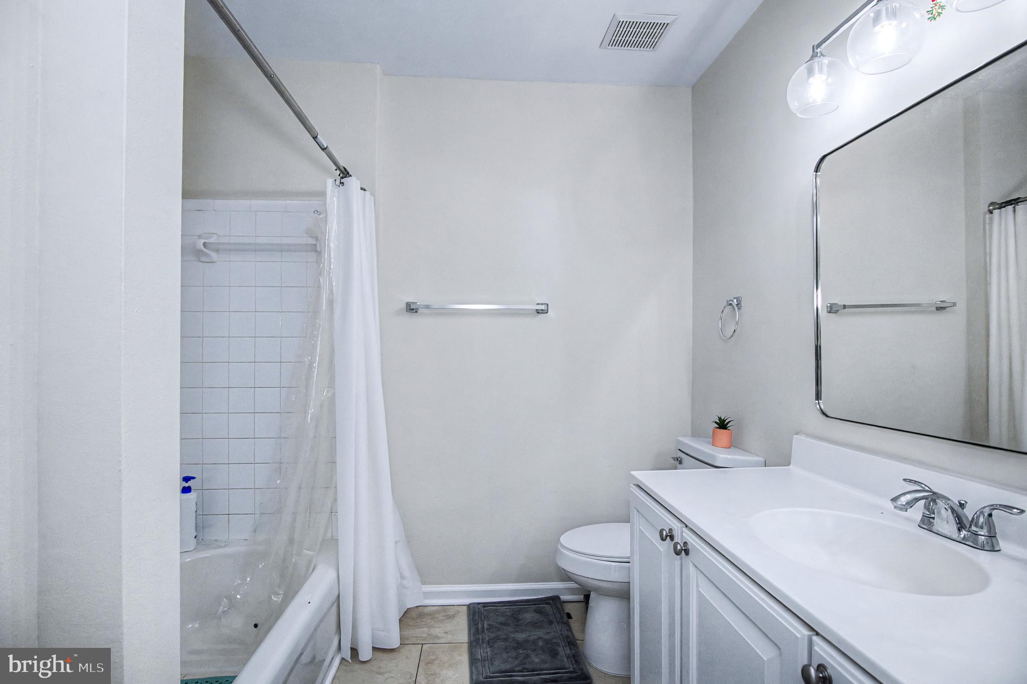 10159 Elgin Way Bristow, VA 20136 - Photo 25 of 41 a bathroom with a sink toilet and shower