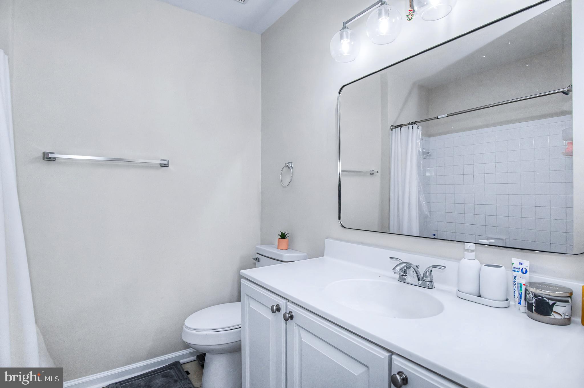 10159 Elgin Way Bristow, VA 20136 - Photo 27 of 41 a bathroom with a sink toilet vanity and shower