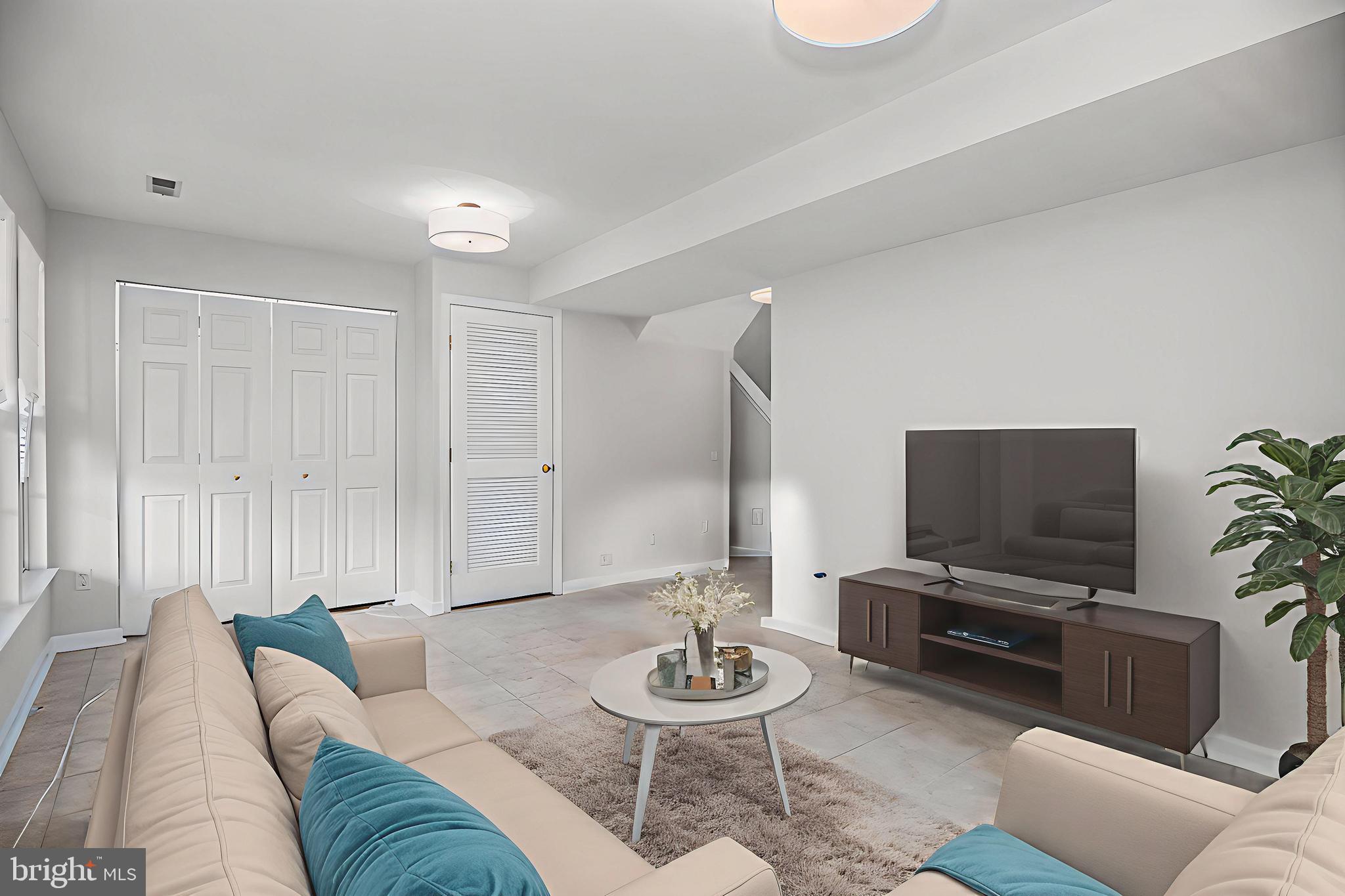 10159 Elgin Way Bristow, VA 20136 - Photo 28 of 41 a living room with furniture and a flat screen tv