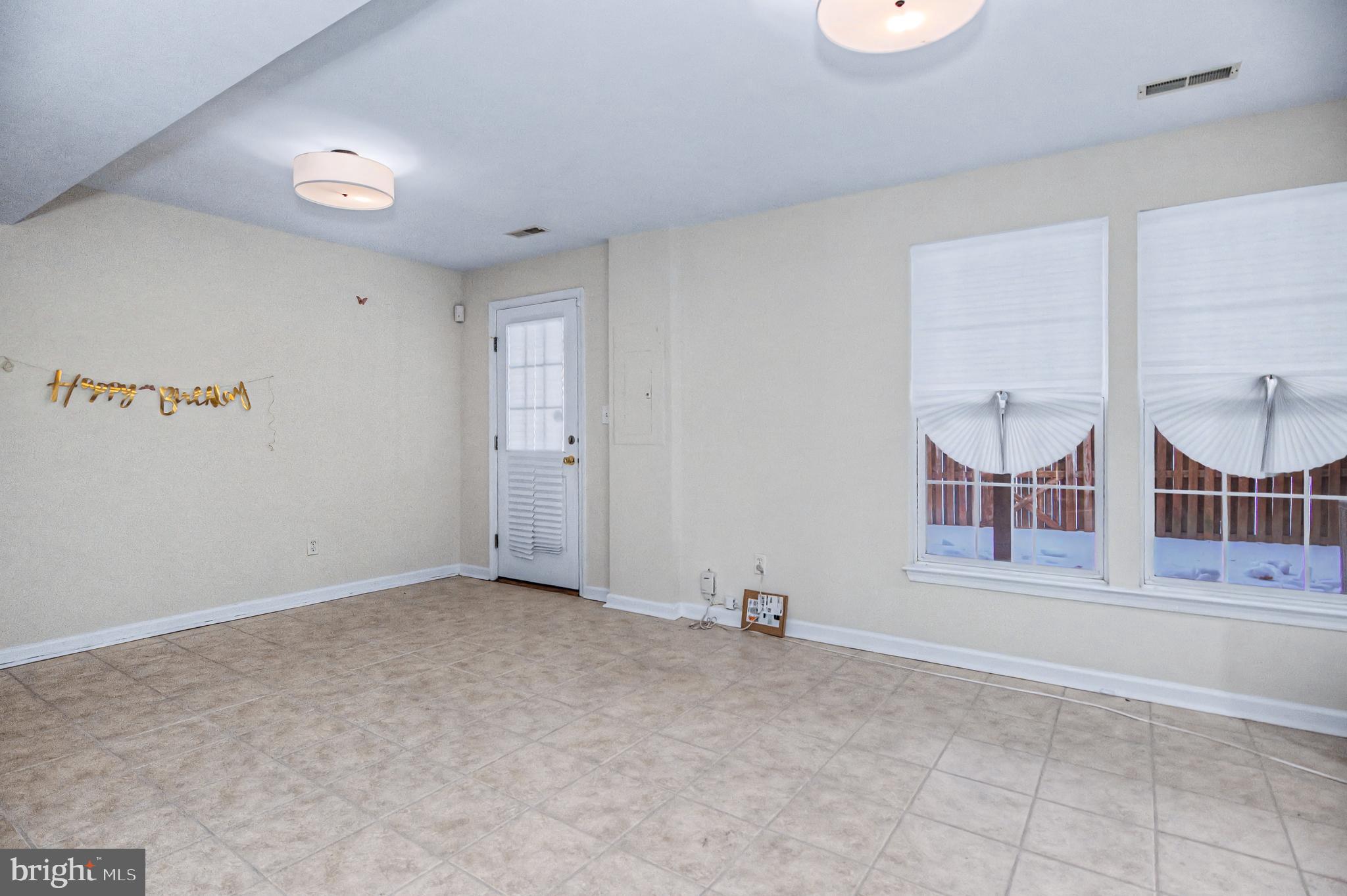 10159 Elgin Way Bristow, VA 20136 - Photo 32 of 41 an empty room with windows and fireplace