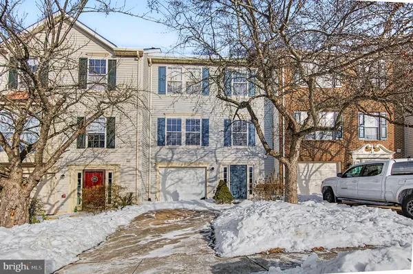 a front view of a house with a snow