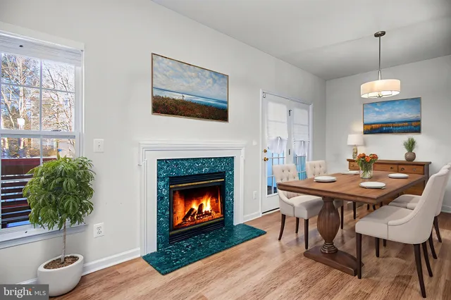 a view of a livingroom with furniture and a fireplace
