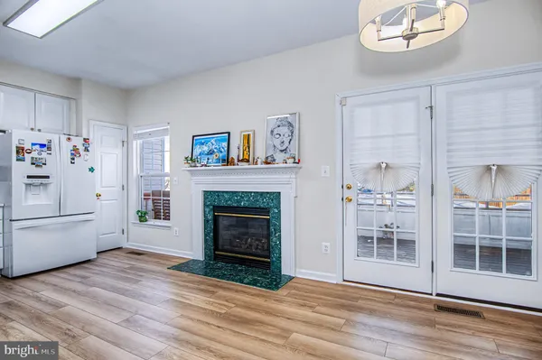 a view of a livingroom with an empty space and a fireplace