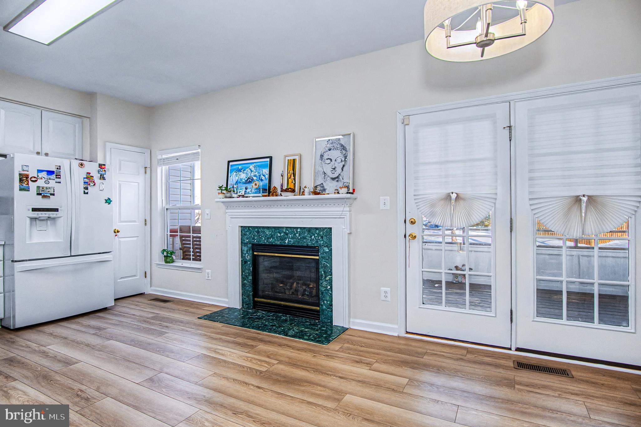 10159 Elgin Way Bristow, VA 20136 - Photo 7 of 41 a view of a livingroom with an empty space and a fireplace