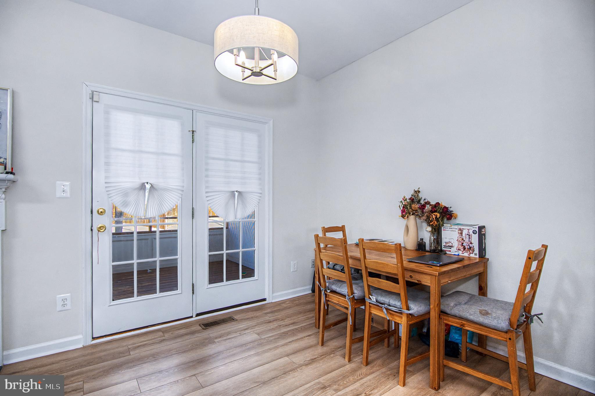 10159 Elgin Way Bristow, VA 20136 - Photo 8 of 41 a view of a dining room with furniture and wooden floor